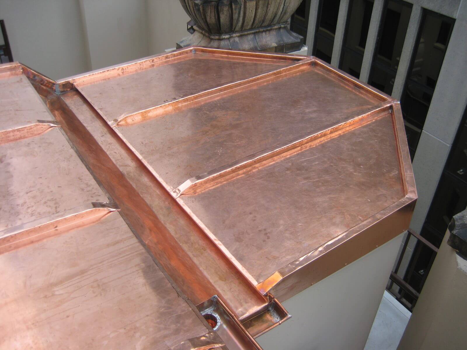 Finished custom copper roof with standing seams