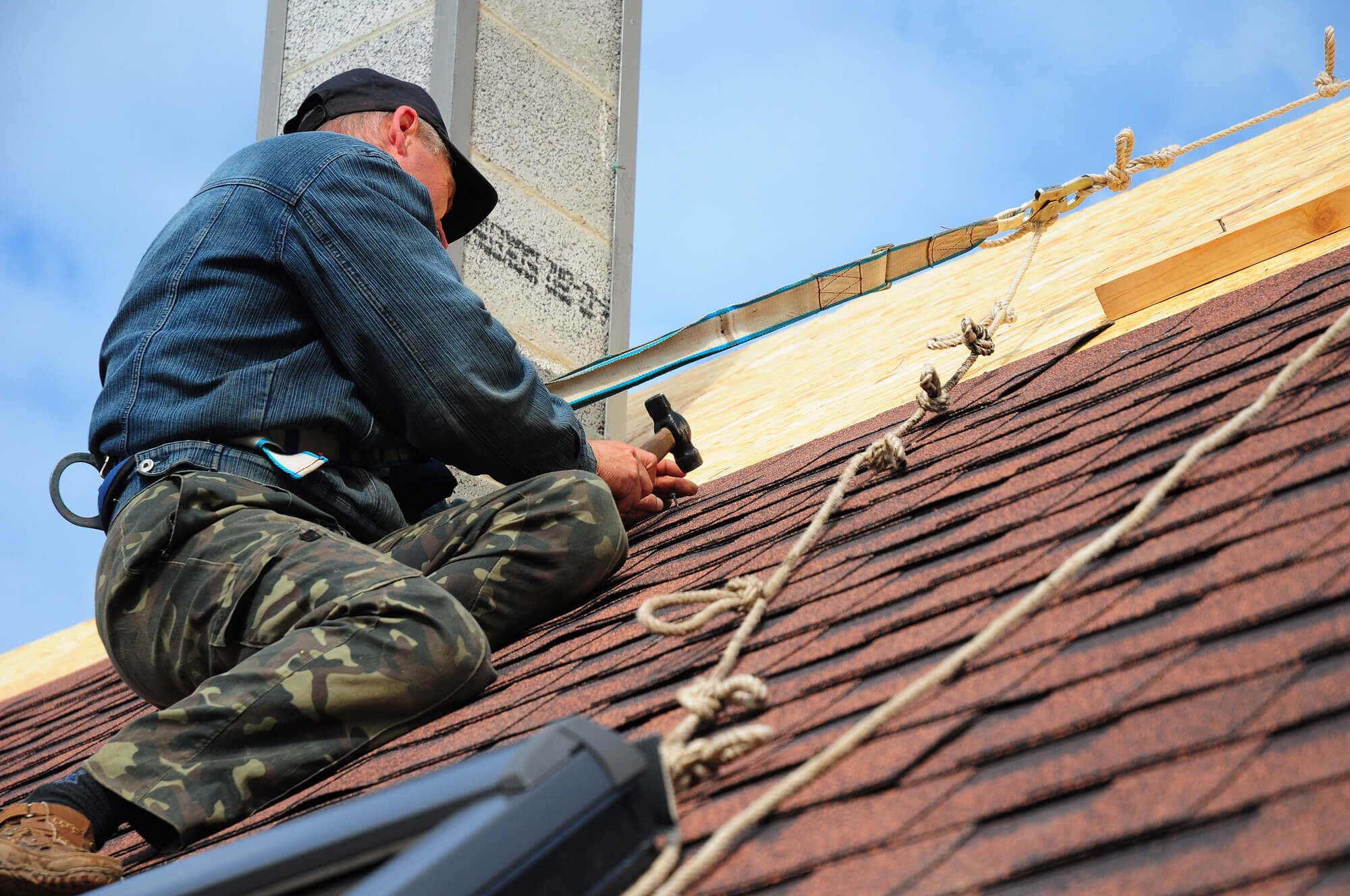 Roof repair work on a residential roof